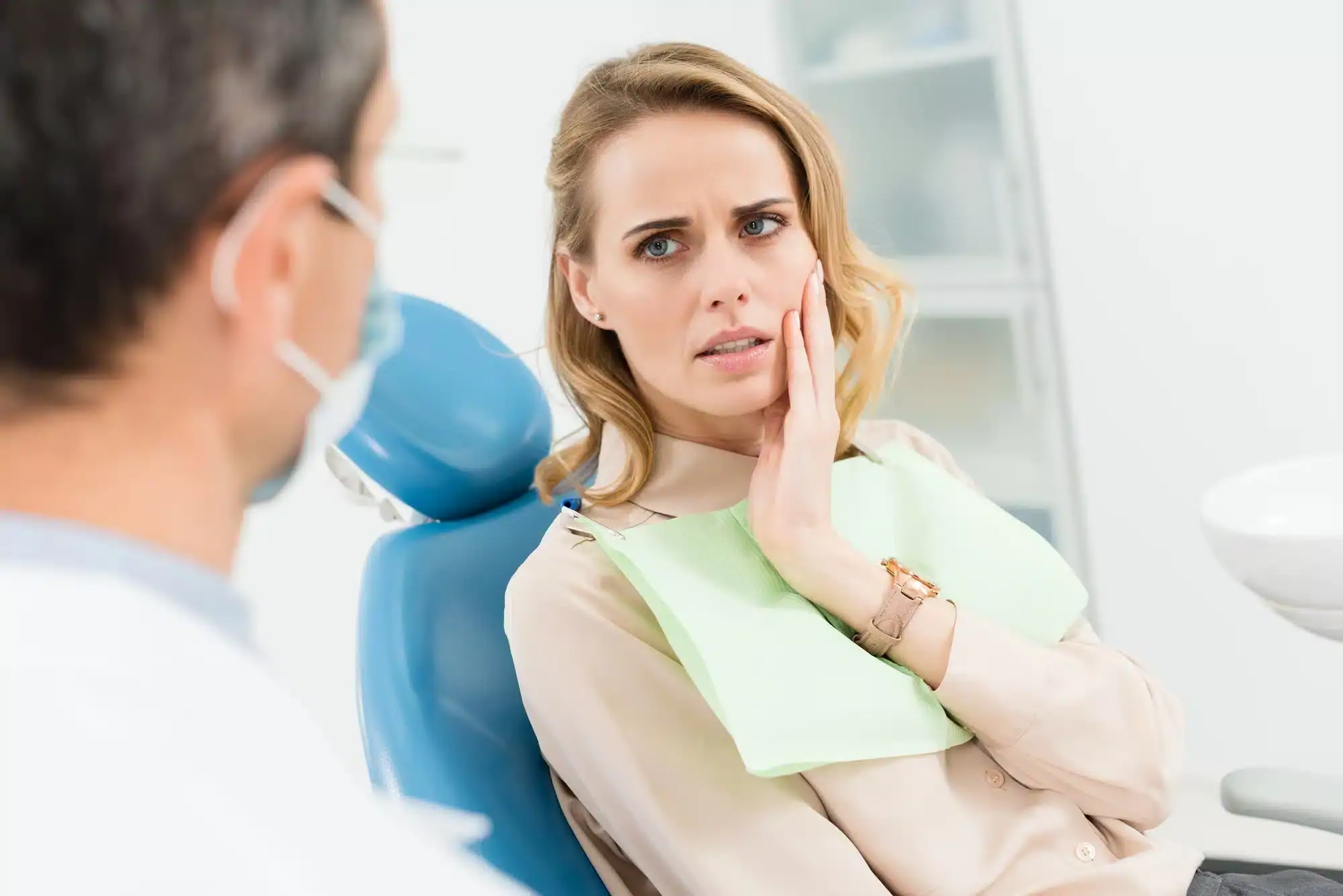 woman visiting an emergency dentist in riverview, mi