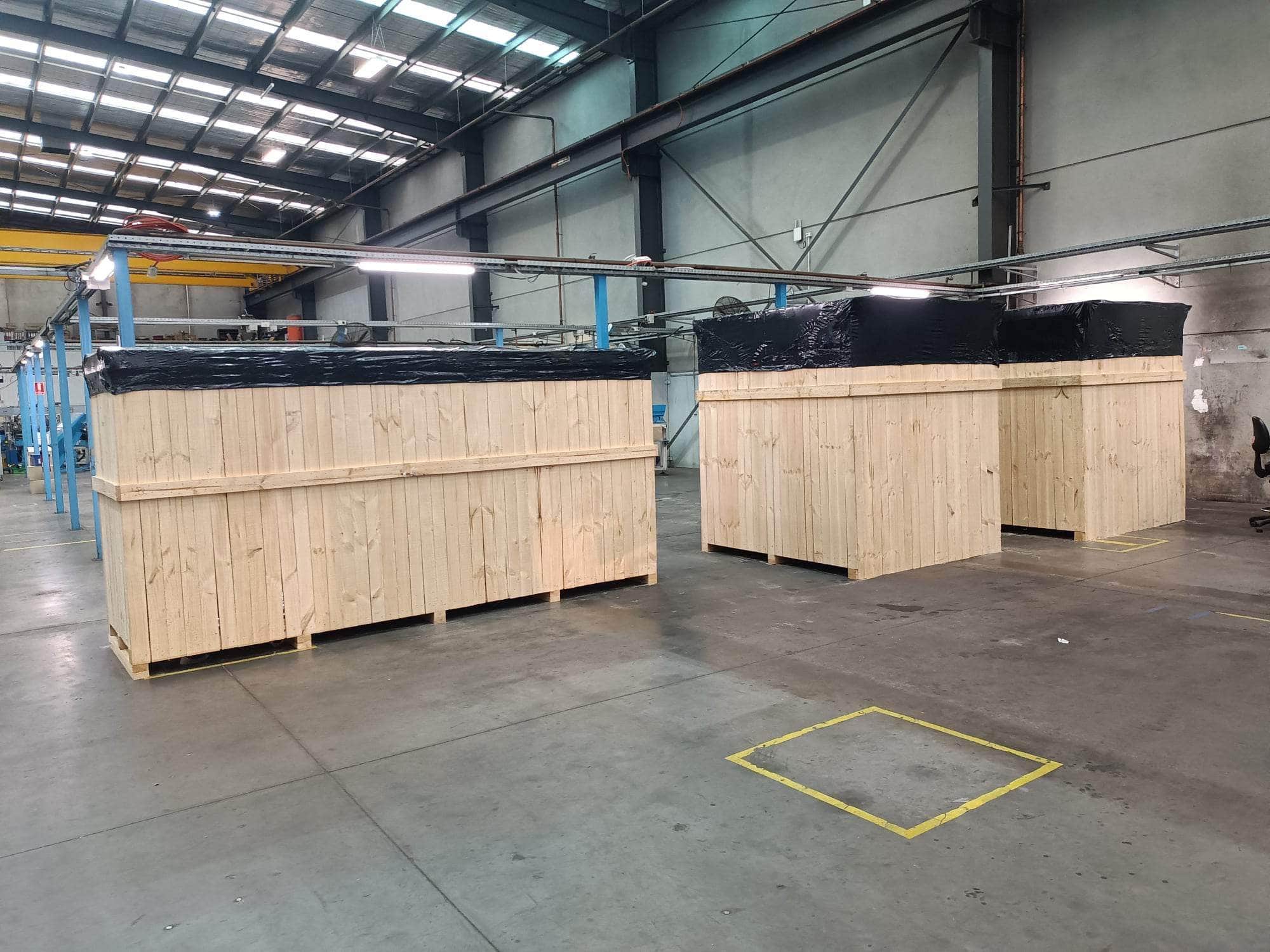 custom crate and black shrink wrap in a melbourne factory