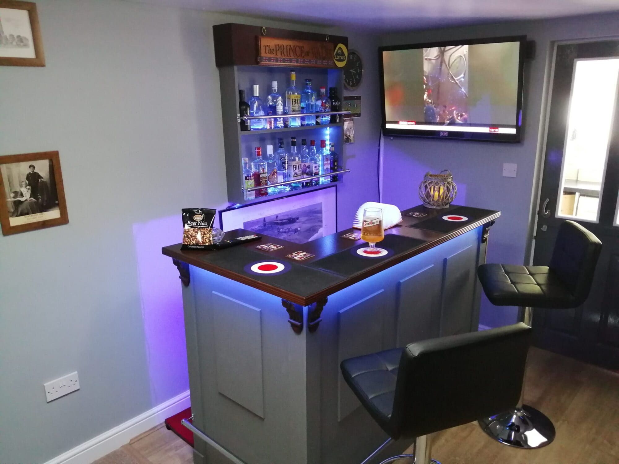 The Abbey bar in grey with a wall bar behind it