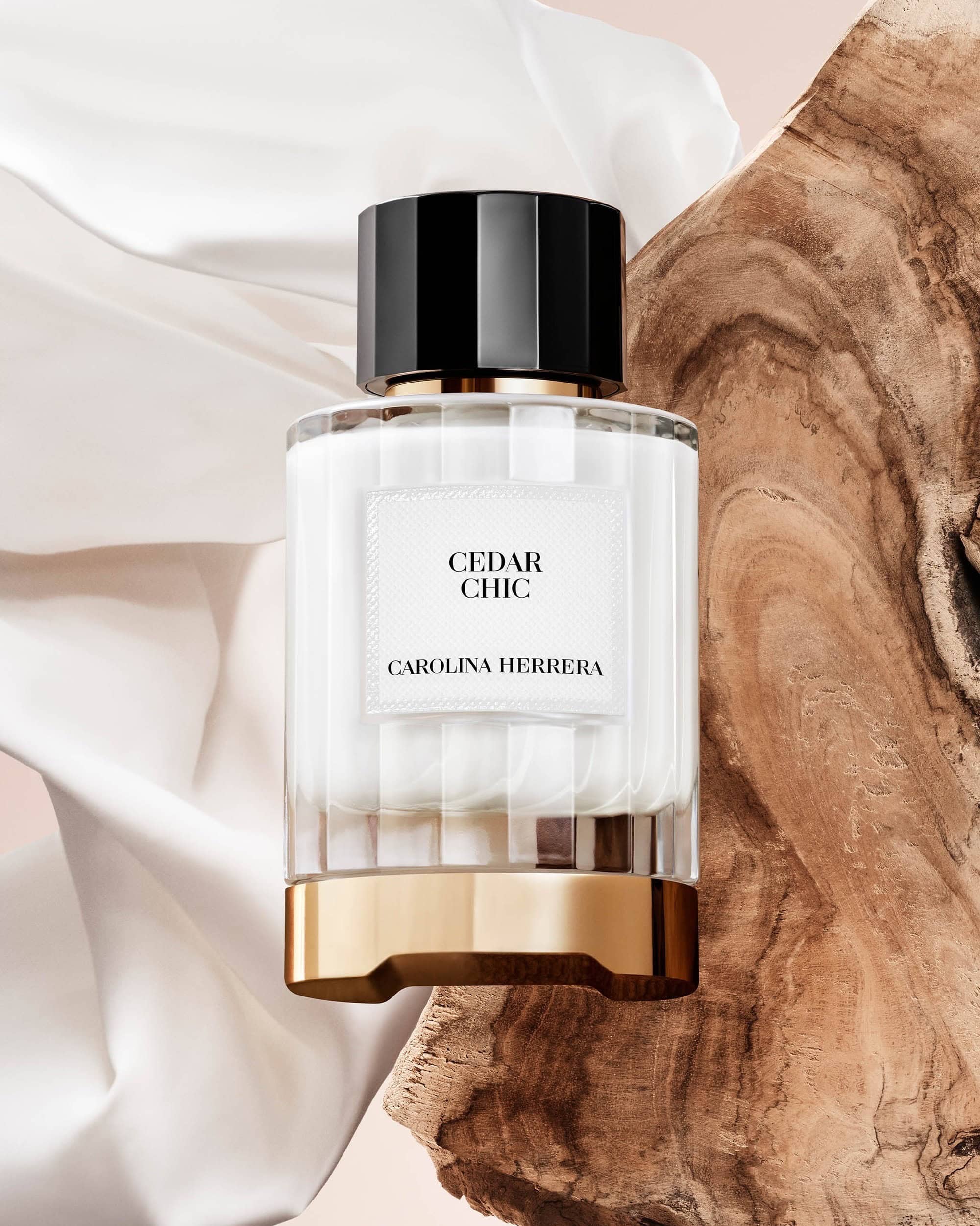 Carolina Herrera Cedar Chic fragrance, a woody floral Eau de Parfum featuring cedarwood, orange blossom, bergamot, and white musk.