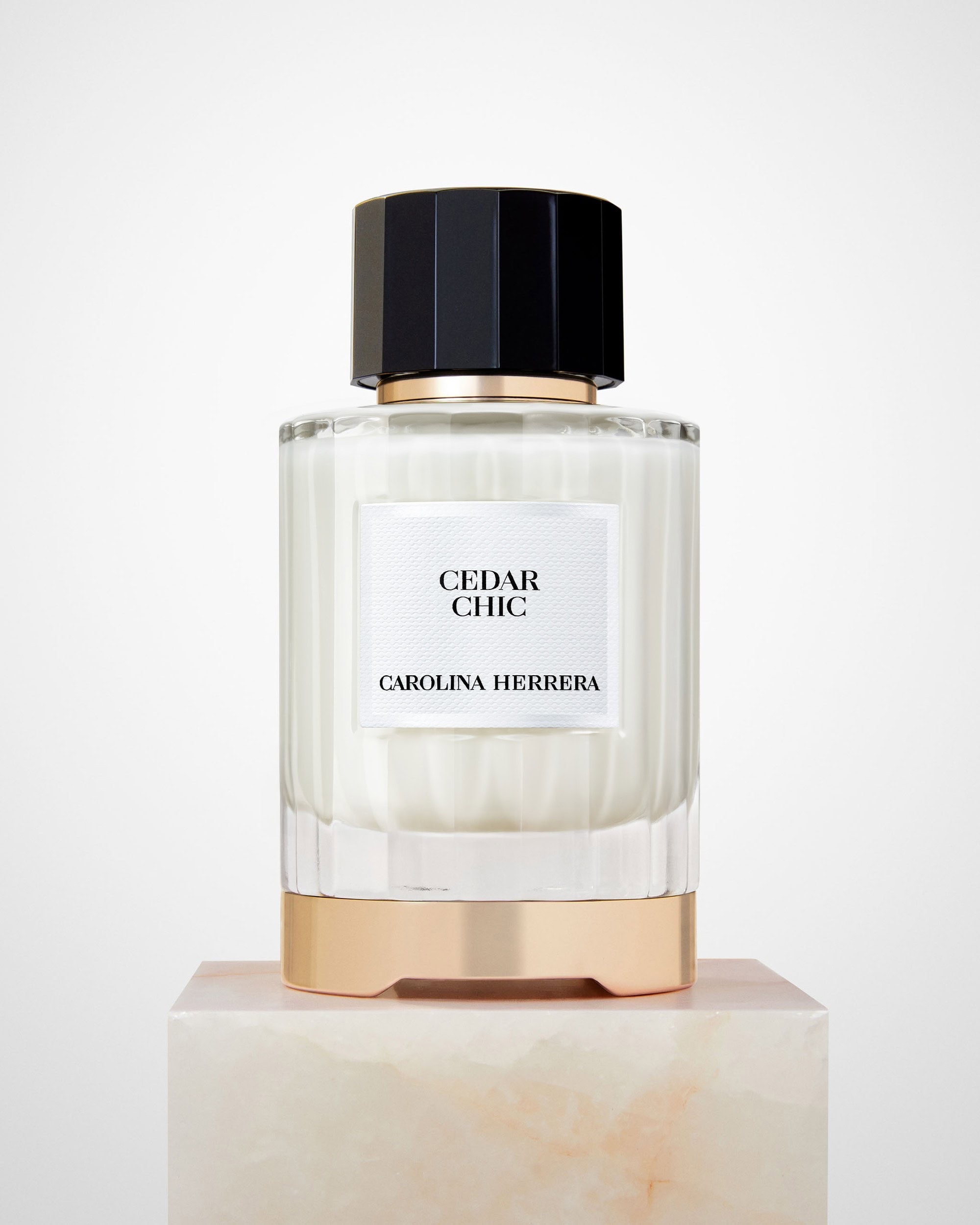 Carolina Herrera Cedar Chic fragrance, a woody floral Eau de Parfum featuring cedarwood, orange blossom, bergamot, and white musk.