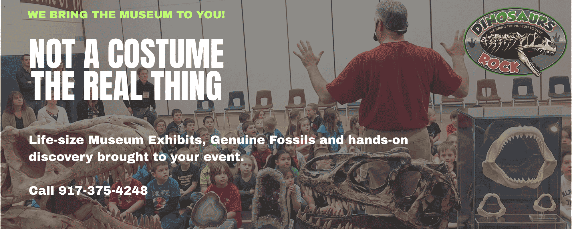Dinosaurs Rock instructor in front of th group of students at a school assembly