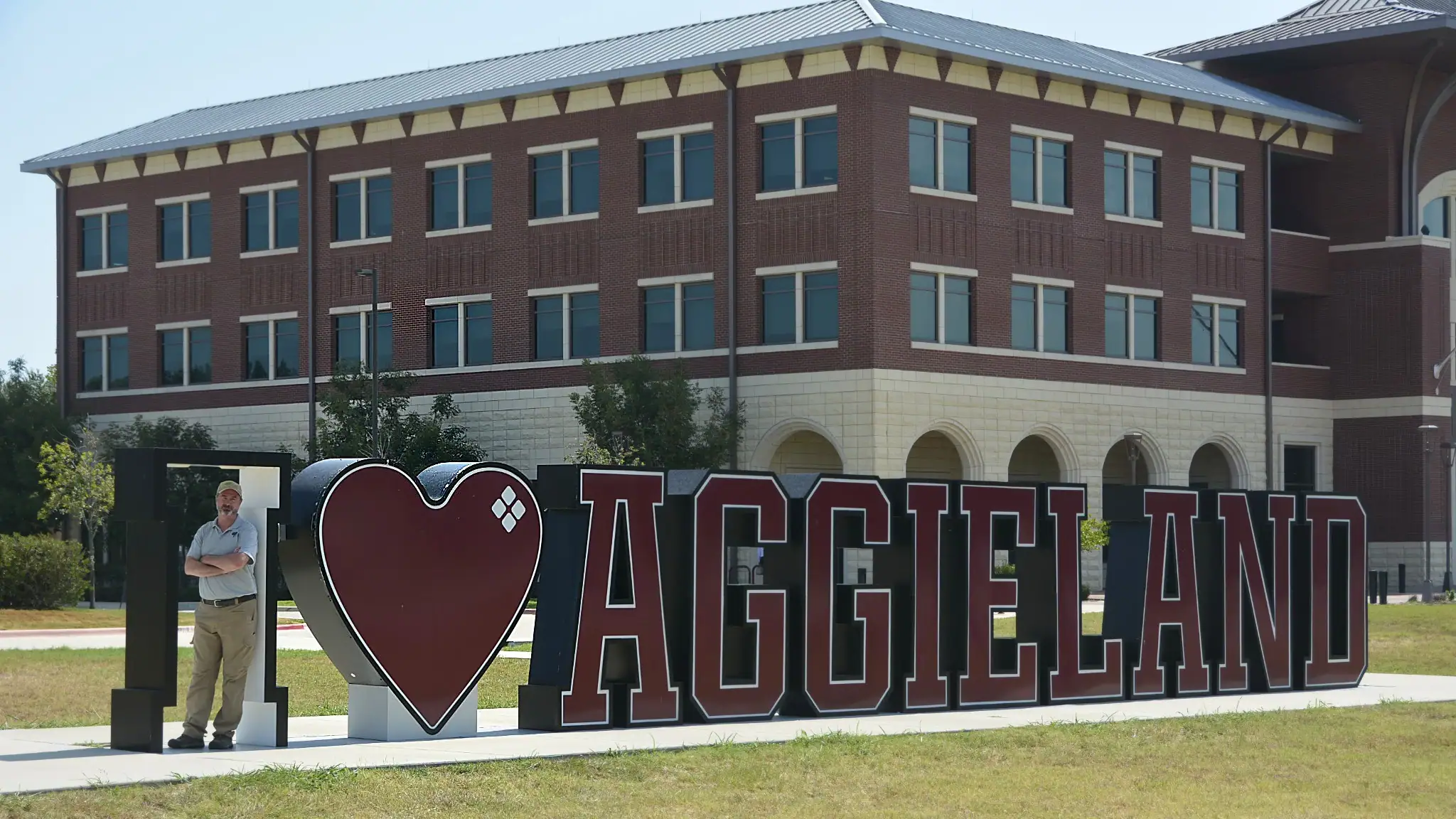 Dr. Scott Lingren at the I love Aggieland sign