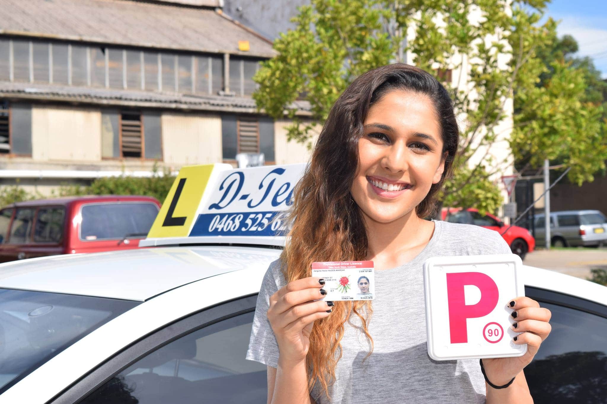 Happy student celebrating passing their driving test in Mount Druitt.