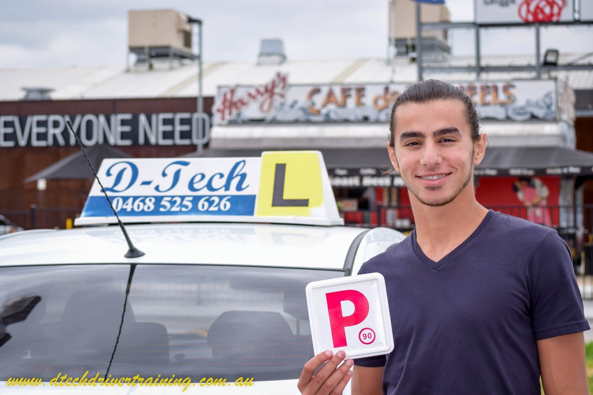 Student proudly showing their P-plates after driving lessons in Toongabbie.