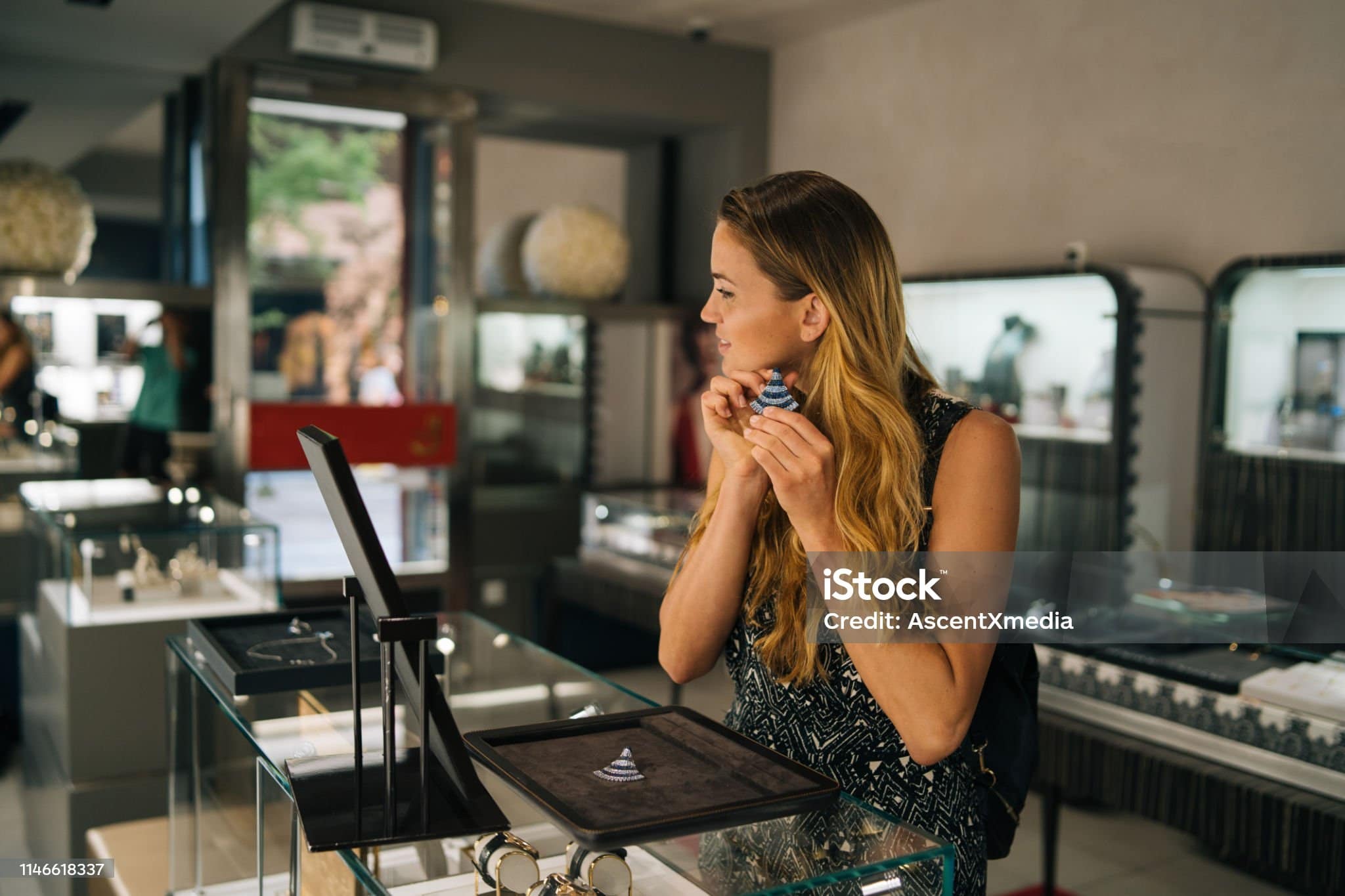She stands in a jewellery store
