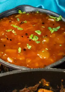 A Bengali-style sweet light green mango chutney tempered with panch phoron (Bengali five spice) and dry red chillies is a simple delight to relish