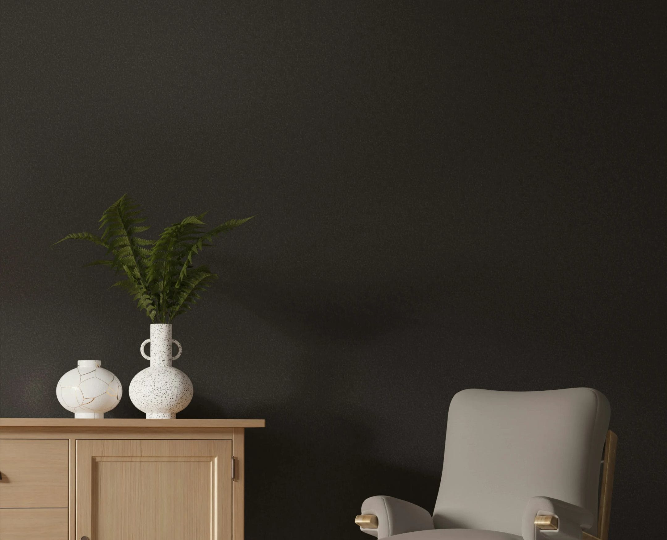 An overstuffed chair and pair of unique vases set off an inviting hospitality design