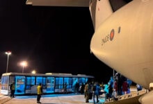 UK nationals disembarking from the first RAF flight from Sudan to Larnaca airport in Cyprus