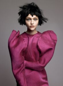 Lanvin editorial look featuring a sculptural pink dress inspired by Alber Elbaz’s signature silhouettes.
