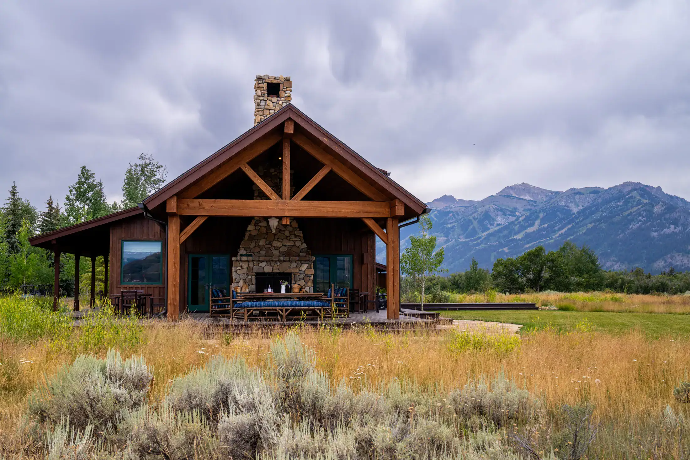 Complete king-post truss over a covered porch with a view of the Tetons