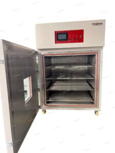 Testron altitude chamber with door open, showing metal shelves and control panel 2/2 Ask ChatGPT 