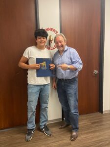 Client celebrates accident claim success with The Miller Law Firm team.