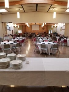 Sanctuary and Social Hall, with tables and chairs set up for an event. 