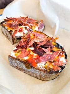 Toast Bar prosciutto, red pepper jelly, and cream cheese toast