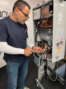 joseph repairing a tankless water heater