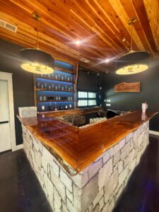 Stone bar with a wood bar top at Romaine Valley Weddings & Events in Fenton, MO
