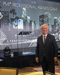 Randall Englund receiving excellence award