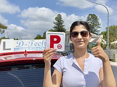 First time practical driving test success milestone with an instructor.