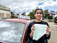 First time practical driving test success milestone with an instructor.