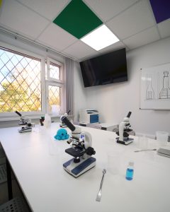Microscopes, beakers and lab glassware close-up, Moscow