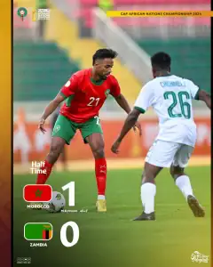 alt= Maroc bat la Zambie 3-1. Youssef Mehri tente de deribler un joueur Zambien.