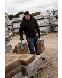 bh_1 A worker using paver clamps to carry large thick pavers