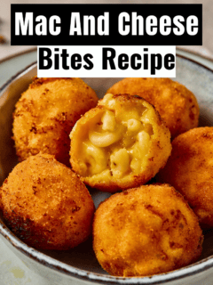The best Mac and Cheese Bites served in a bowl next to blocks of sharp cheddar cheese.