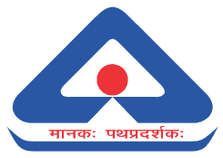 BIS logo, blue triangle with a red dot in the center, and the Hindi motto "मानकः पथप्रदर्शकः" (Manak Pathpradarshak) in red text below.