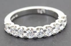 Elegant diamond eternity ring in white gold with sparkling round-cut stones.