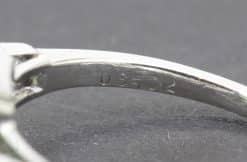 Jewelry stamp with serial number 03252 for authenticity verification.