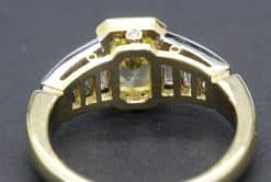 Elegant gold and diamond ring with a central gemstone, crafted by Weldons Jewellers. Perfect for spe.