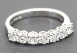 Diamond eternity ring with sparkling round-cut stones in platinum setting.