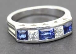 Elegant sapphire and diamond ring with a silver band, perfect for special occasions.