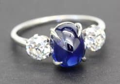 Elegant blue sapphire and diamond ring with a silver band, perfect for special occasions.