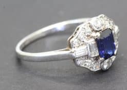 Silver ring with a central blue sapphire and surrounding diamonds, fine jewelry from Weldons Jewelle.