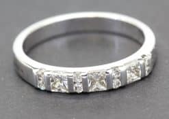 Elegant diamond eternity ring in white gold with sparkling stones.