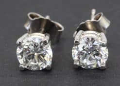 Diamond stud earrings in silver settings for women.