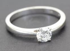 Classic solitaire diamond engagement ring in silver, showcasing fine craftsmanship.