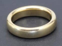 Gold wedding band ring, perfect for engagement or wedding jewelry.
