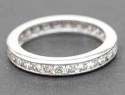 Diamond eternity ring with sparkling stones in a silver band.