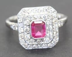 Stunning ruby and diamond ring with a square-cut ruby center and diamond accents, crafted by Weldons.