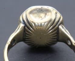 Vintage silver ring with intricate sunburst design, crafted by Weldons Jewellers.