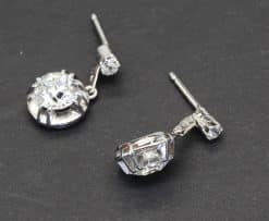 Diamond drop earrings with sparkling gemstones and silver settings.