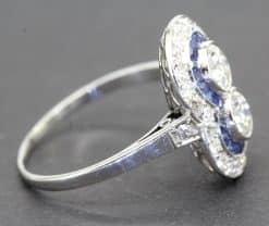 Beautiful sapphire and diamond ring with intricate design and sparkling gemstones. Perfect for speci.