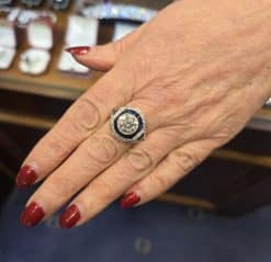 Elegant diamond and sapphire ring with intricate design, perfect for special occasions.