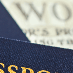 Image of passports and world newspaper