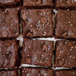 Overhead view close-up of tahini brownie grid with salt sprinkled atop.