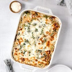 top shot of oven baked paleo chicken casserole next to utencils