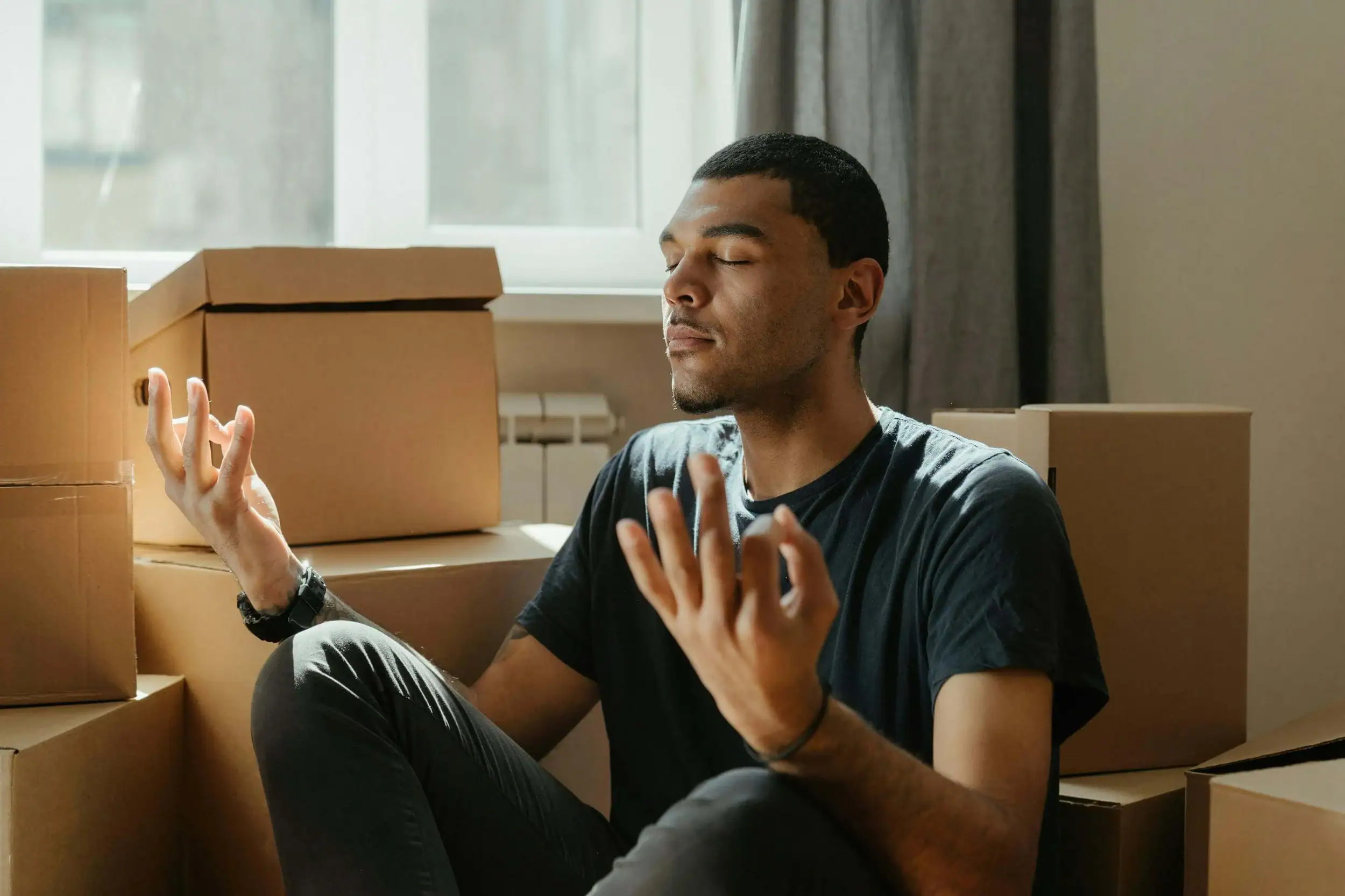 man meditating, relaxed and grounded after working with a somatic therapist in Detroit through somatic therapy in Michigan.